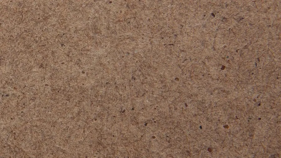 Close-up of the fine, uniform fiber surface of an MDF panel