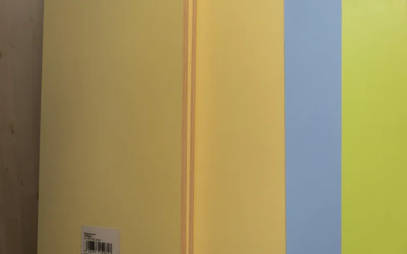 colored MDF panel edges lined up on a hardware store shelf
