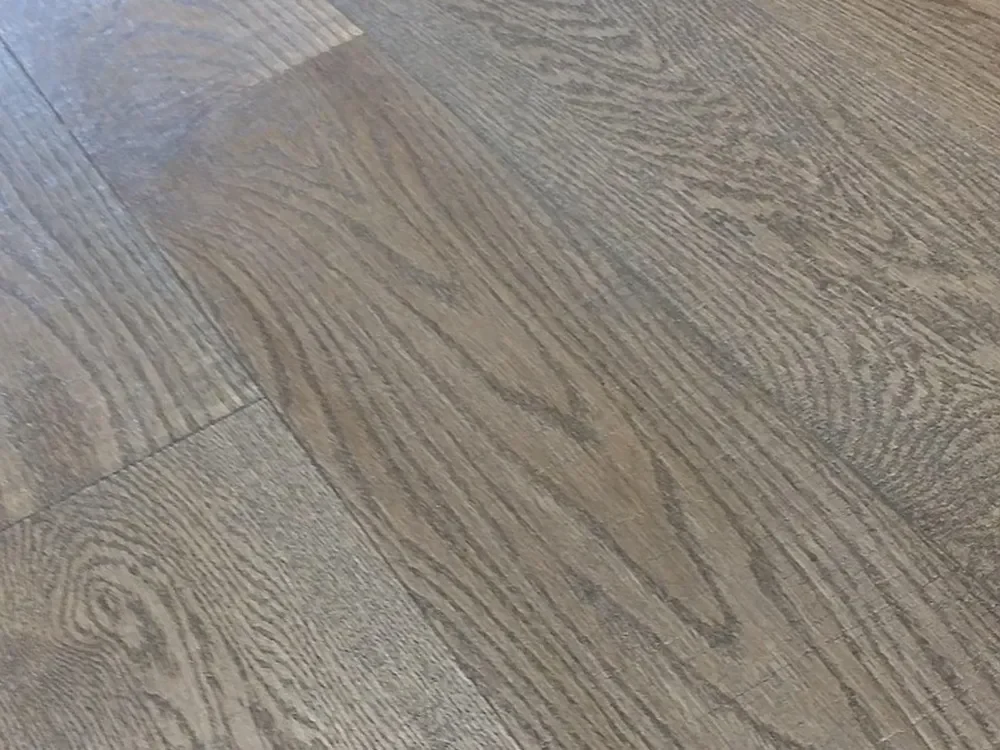 Close-up of oak hardwood flooring showing open cathedral grain
