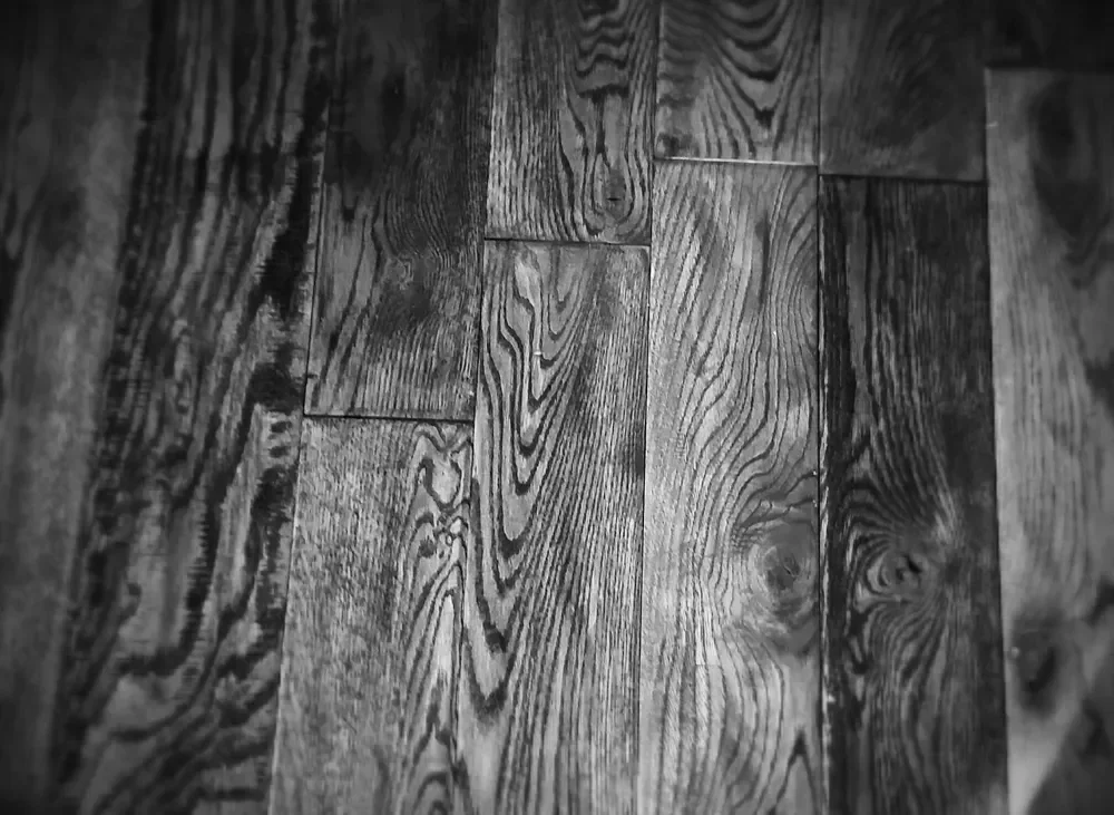 Close-up of oak hardwood flooring planks showing the open grain pattern
