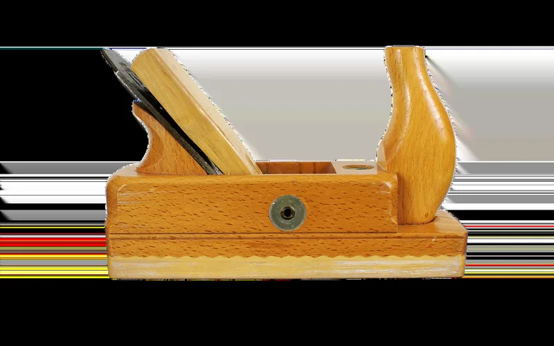 Benchtop wood planer showing the cutterhead housing where helical or spiral inserts are mounted