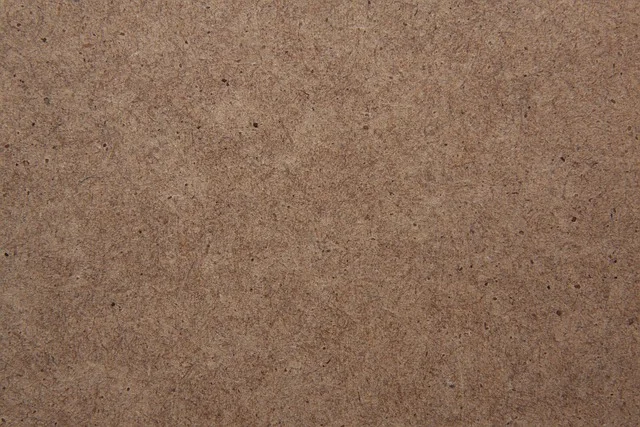Close-up of raw MDF fiberboard surface texture showing its dense, uniform composition