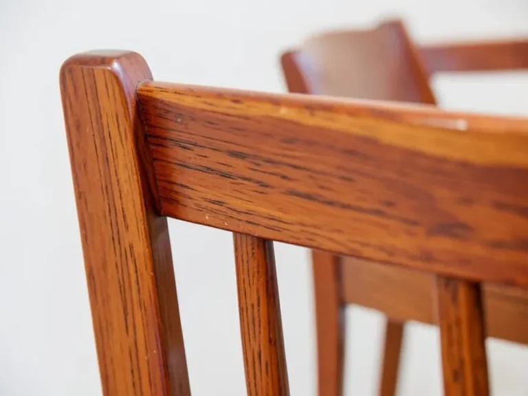 Close-up of a solid cherry wood dining chair back showing grain and joinery
