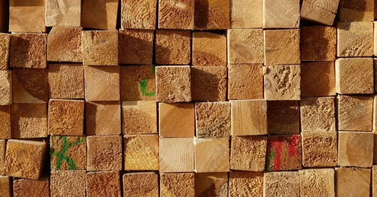 End grain of stacked dimensional lumber pieces in a lumber stack