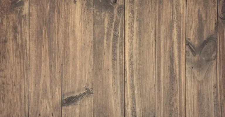 Warm brown hardwood plank floor boards laid side by side