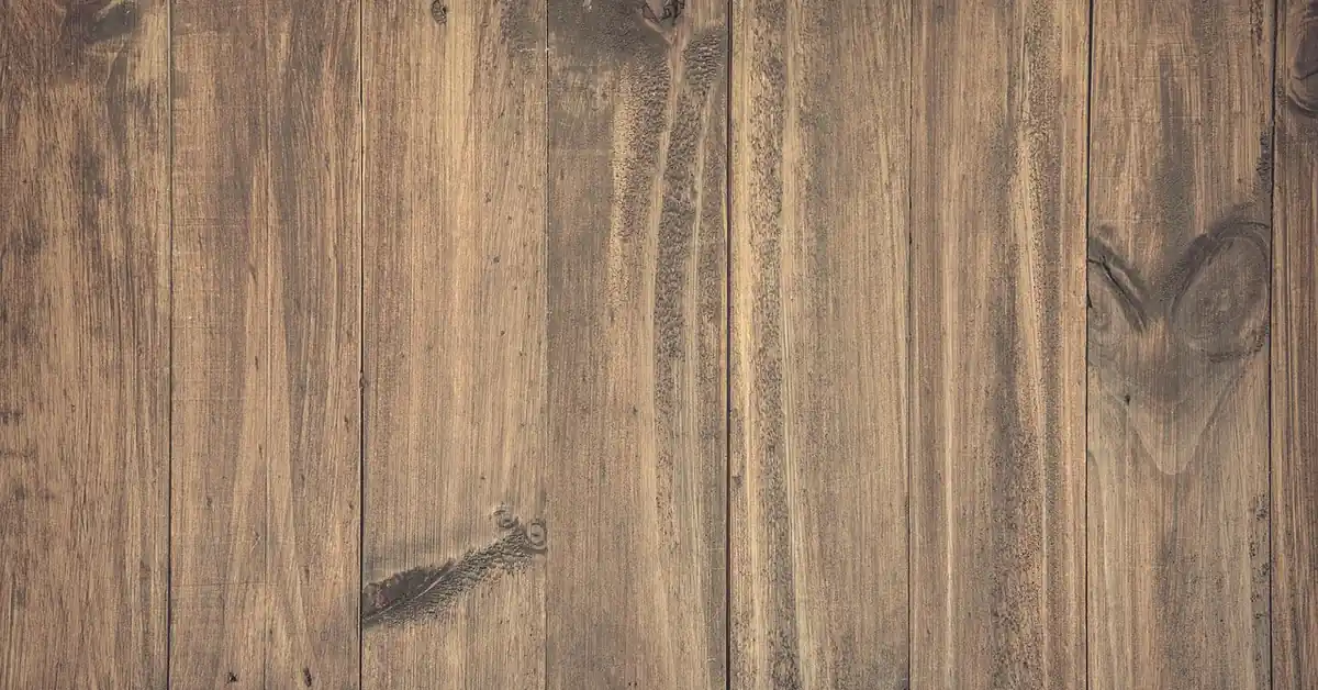 Warm brown hardwood plank floor boards laid side by side