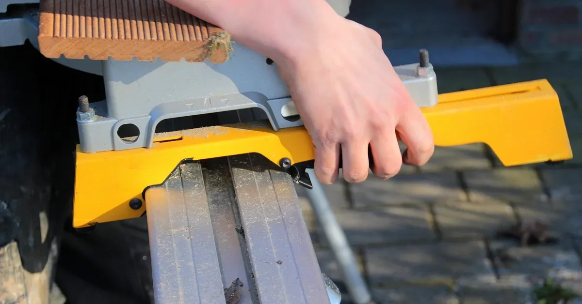 Miter saw with extension work support while cutting a board