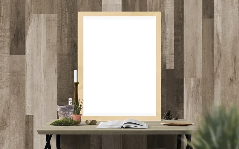 Framed picture hung on a wall using an adhesive strip mounting method