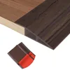 Self-adhesive vinyl floor transition strip
