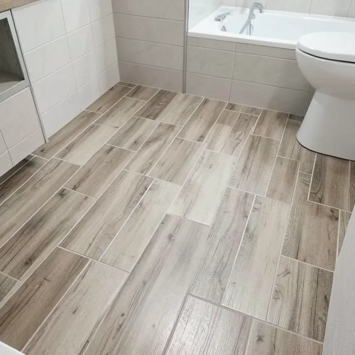 Bathroom floor with wood-look porcelain tile in a staggered pattern