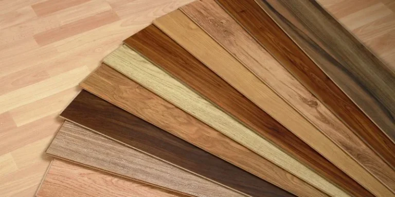 A fan of wood flooring samples showing the range of trending colors