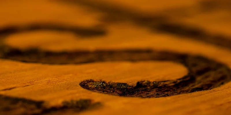 Wood stain color test swatch on a board