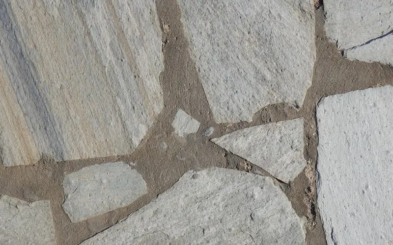 bare outdoor concrete slab surface showing texture and porosity