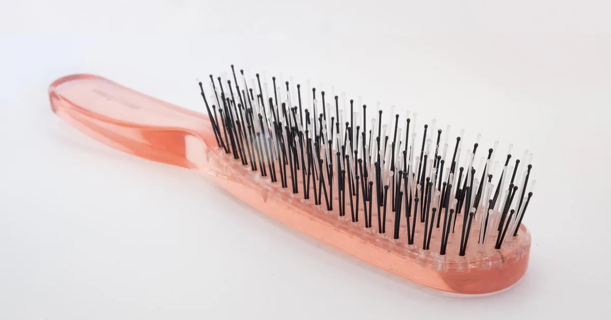 close-up of natural bristles on a hairbrush before cleaning