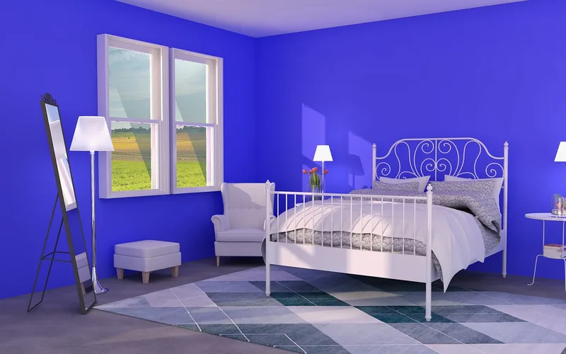 wood bedroom furniture against a deep blue accent wall