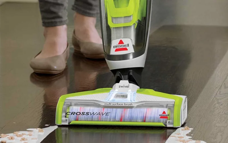 Bissell CrossWave wet-dry vac cleaning a spilled milk and cereal mess off a sealed wood floor
