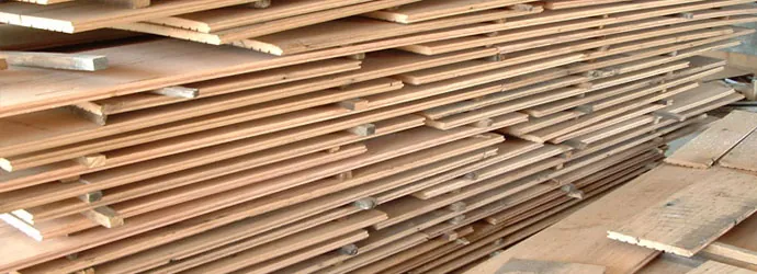 Engineered hardwood planks fanned and stacked before installation