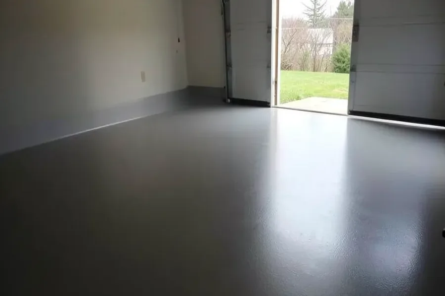 Finished gray epoxy-painted concrete garage floor after a full cure