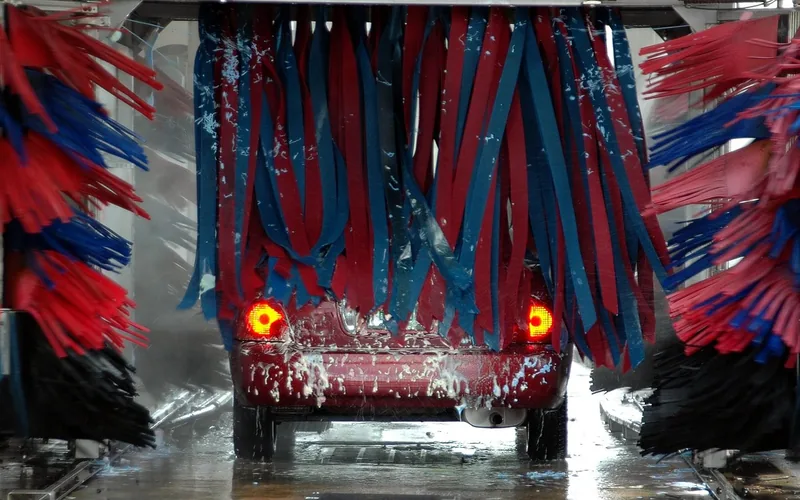 gas pressure washer spraying a concentrated water jet outdoors