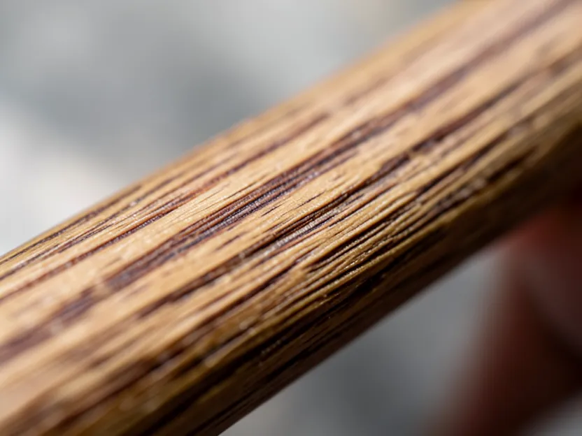 Close-up of straight wood grain running the length of a hickory axe handle