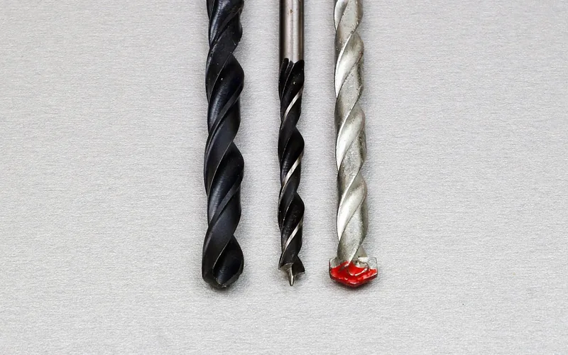 Three drill bit types compared, including a carbide-tipped masonry bit