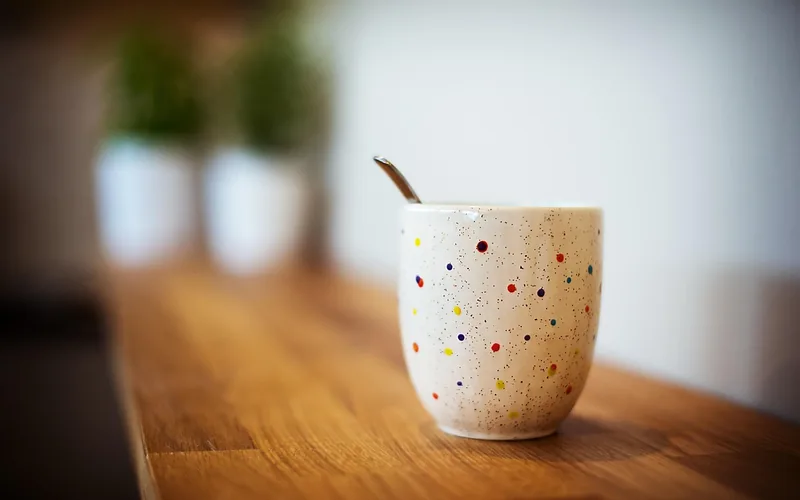 mug on wood table water ring cause ceramic mug placed directly on a wood table without a coaster, a common cause of white water rings