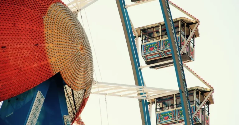 Brightly painted Ferris wheel gondolas at a Bavarian folk festival