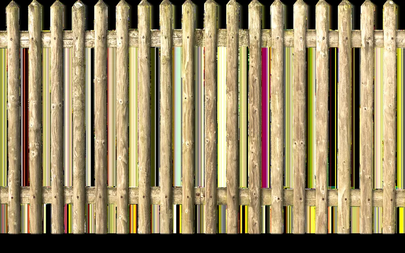 Wooden fence slats made from pressure treated lumber Wooden fence slats made from pressure treated lumber