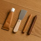 wood floor no-sand repair kit with filler tube, putty knife, and wax sticks