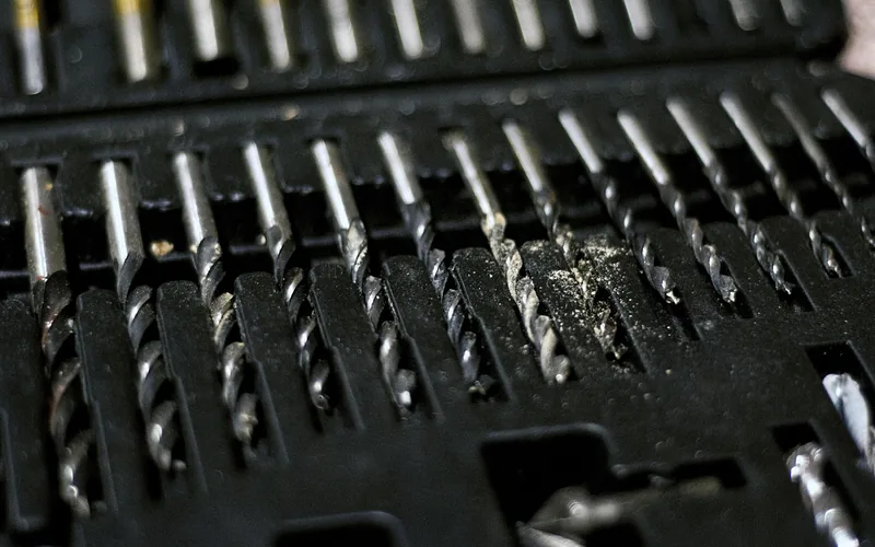 A set of twist drill bits in assorted sizes stored in an organizer case