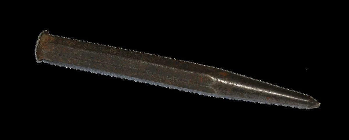 A center punch marking a precise starting point before drilling