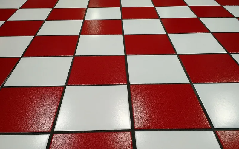 glossy ceramic tile floor with dark grout lines