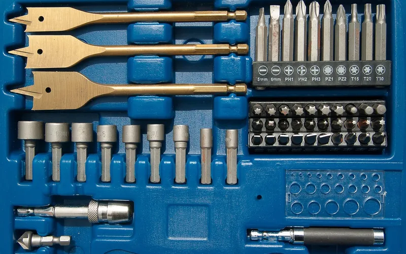 assorted drill and driver bits including small fractional sizes in a labeled case
