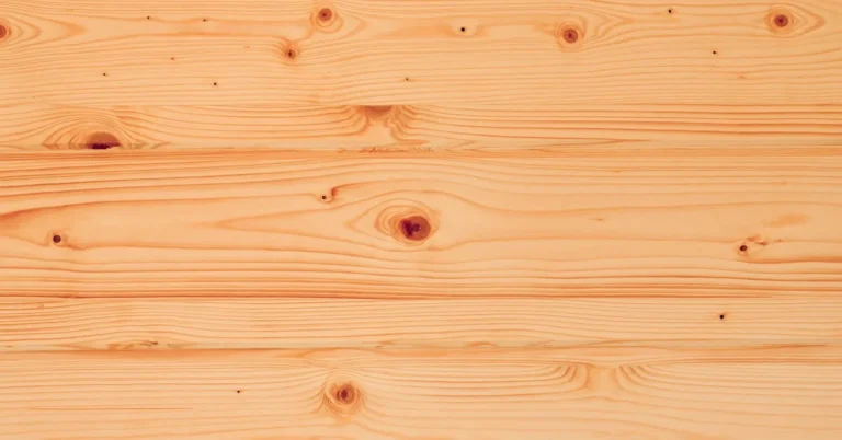 Knotty pine wood paneling boards with visible knots before painting