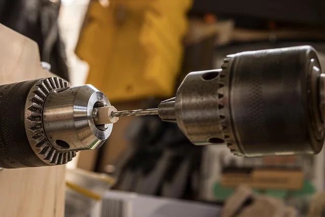 Close-up of a drill chuck holding a twist bit, illustrating proper bit selection and drill maintenance