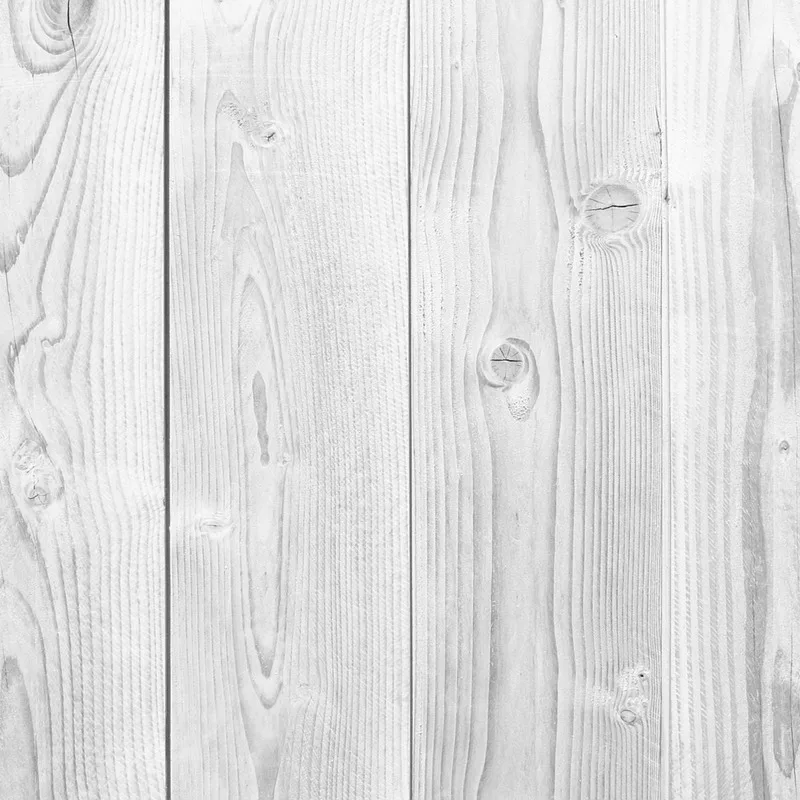 Whitewashed wood grain showing a light, translucent painted finish
