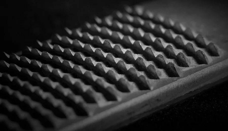 Close-up of the raised teeth on a wood rasp