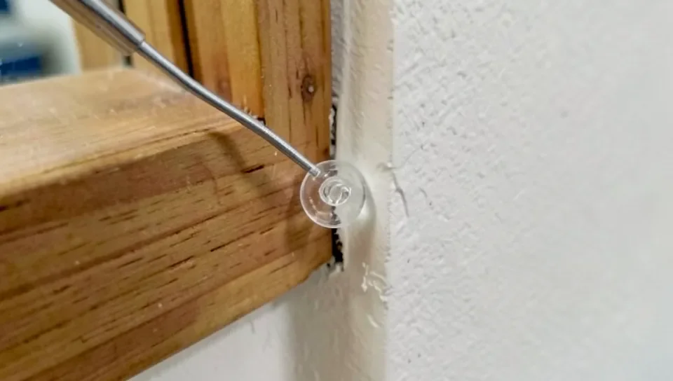 Applying a bead of caulk to seal a trim gap
