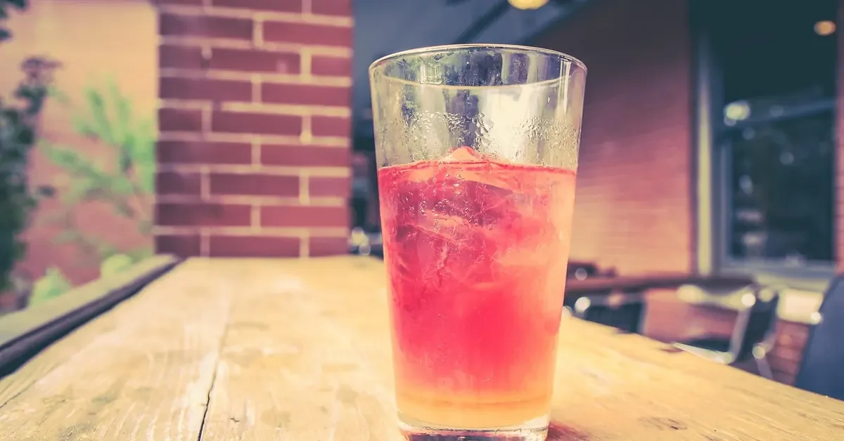 Cold drink sweating on a wood table, a common cause of water marks