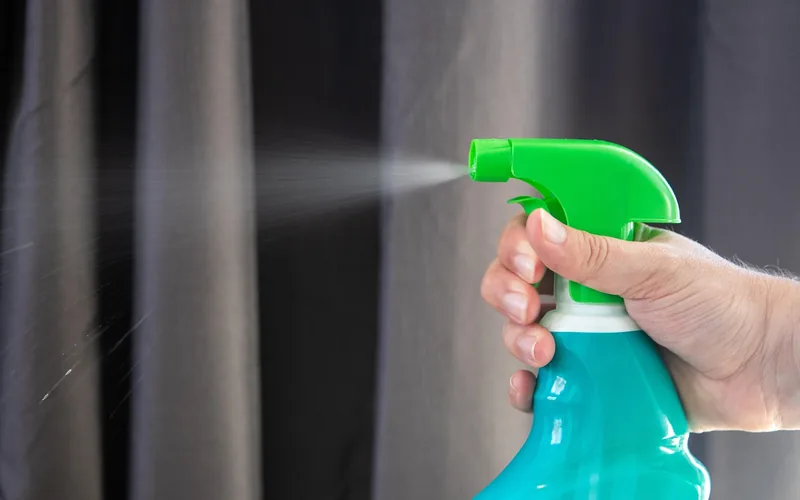 concrete dissolver spray applied to painted surface during cleaning