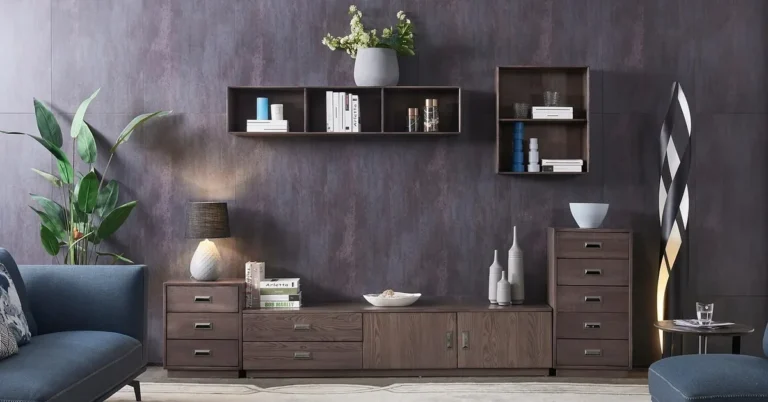 Two wooden floating wall shelves above a low cabinet in a living room