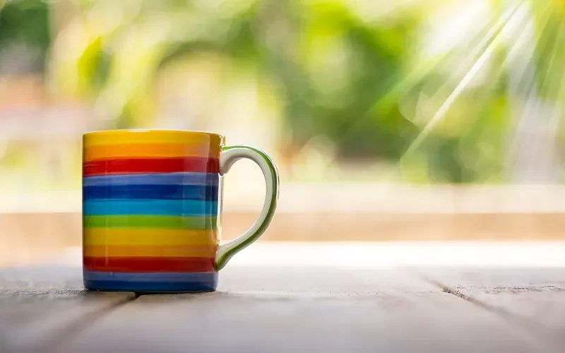 Hot mug resting on a wooden table, which can leave a heat ring