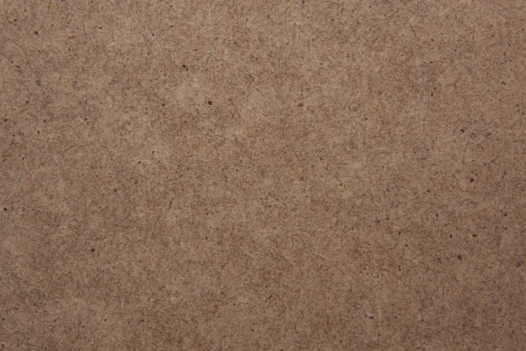 Close-up of the smooth brown surface of an MDF panel