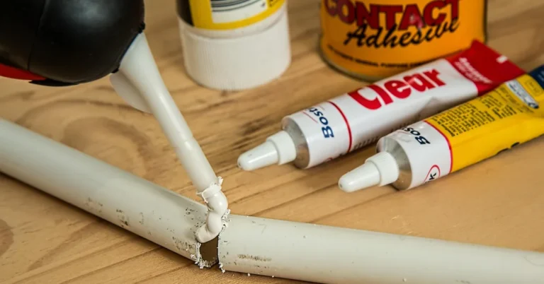 clear adhesive being applied to a joint before pressing two pieces together
