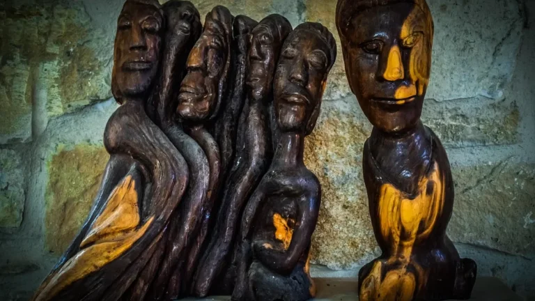 Carved and polished wooden sculpture of flowing, grouped figures