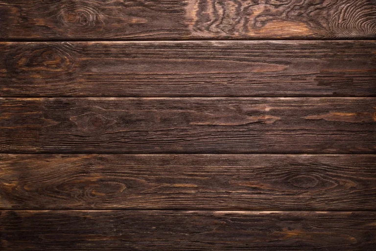 Dark stained wood plank texture representing walnut and acorn wood stain color tones