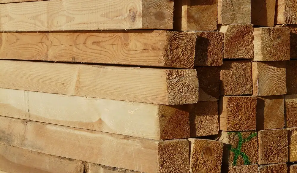 Stack of fresh-cut cedar decking lumber showing grain and end grain detail Stack of fresh-cut cedar decking lumber showing grain and end grain detail