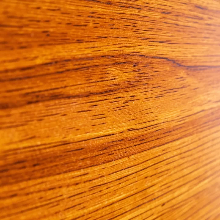 Close-up of warm amber cedar wood grain texture