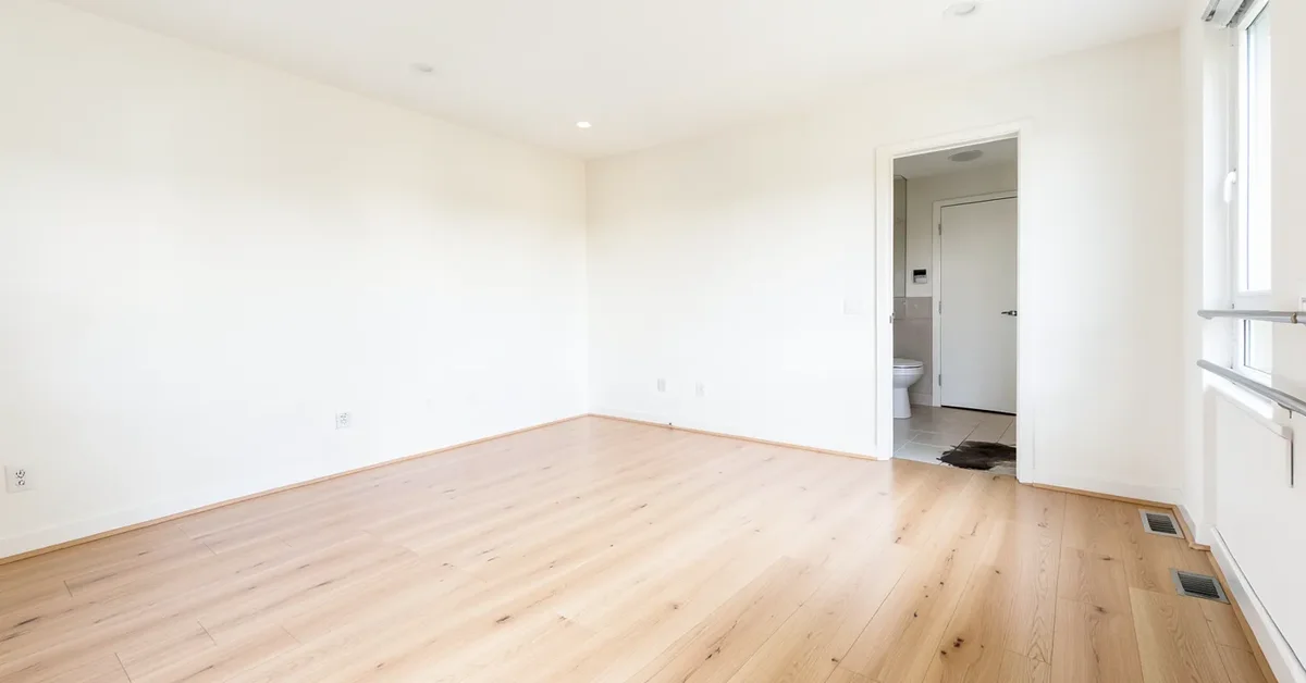 Clean light hardwood floor in a bright room
