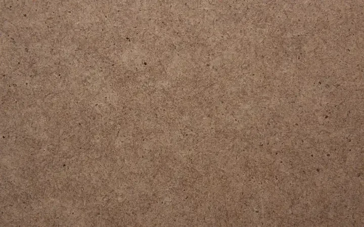 Close view of an MDF panel face showing uniform fibers with no wood grain Close view of an MDF panel face showing uniform fibers with no wood grain